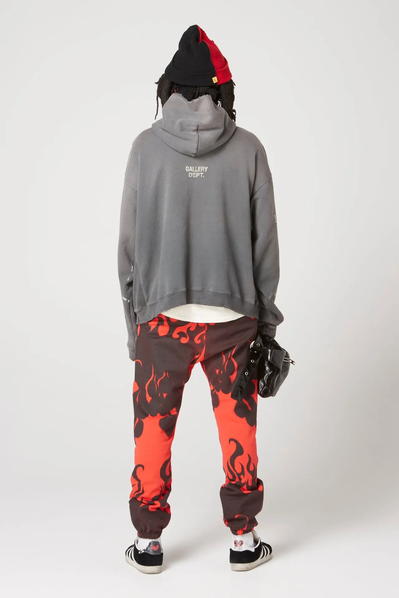 GALLERY DEPT. 90'S RECYCLE HOODIE WASHED BLACK 90'S washed hoodie with distressed eco-friendly slogans. Washed black S-XL. Ready-made garments are washed and dyed again. Multiple spots throughout the body are spray-faded. The ribs are cut and worn.